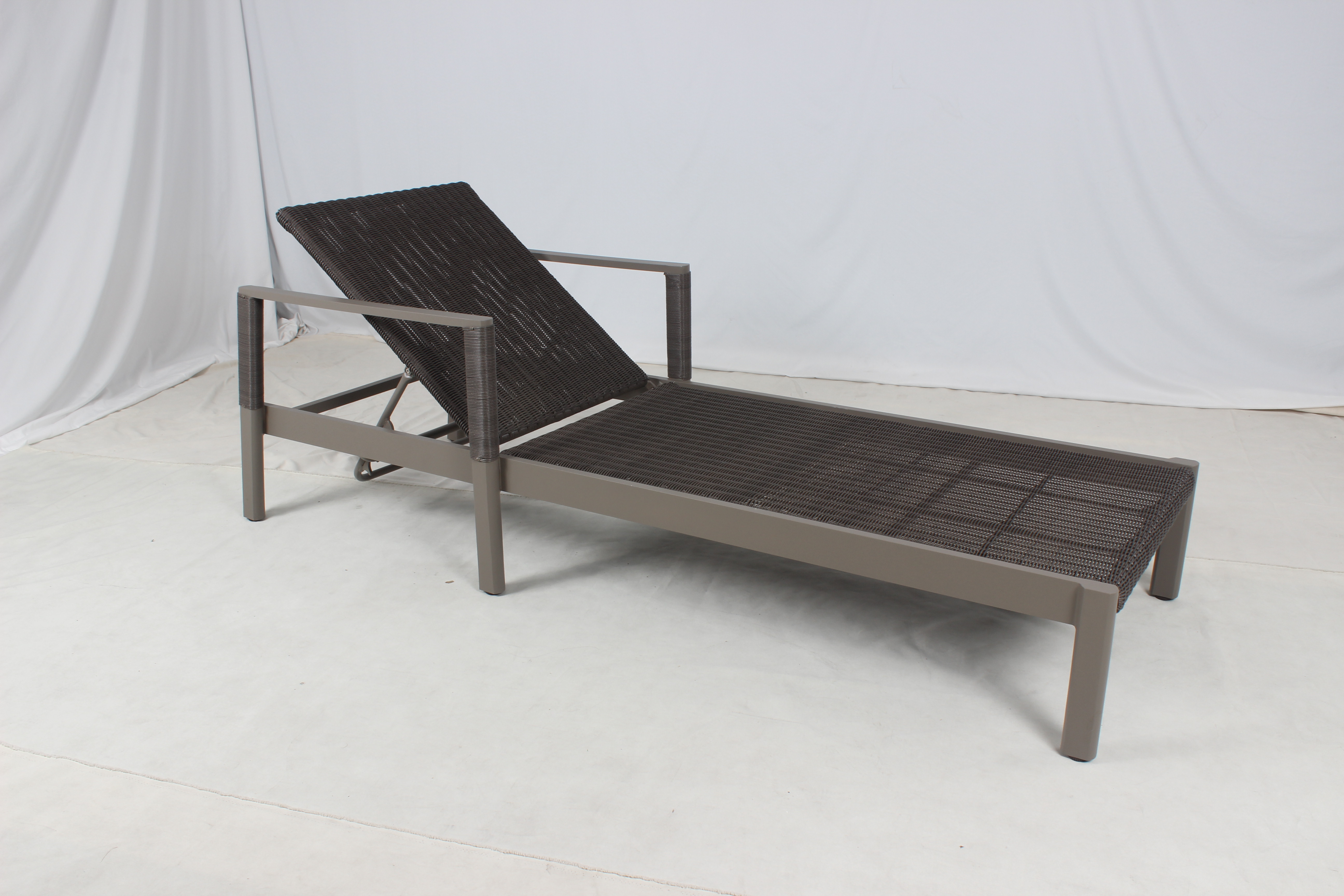 Outdoor wicker patio lounger with armrest